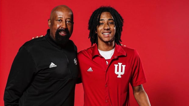 Boogie Fland, a five-star point guard in the class of 2024, is pictured with Indiana coach Mike Woodson during an official visit to Bloomington in June.